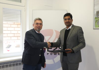 Dr. Sasha Savic and Anand K Pandey shaking hands after signing the agreement between E2S Power and India Power